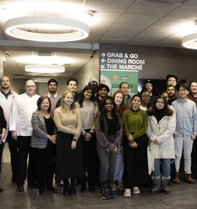a photo of a group in a meal hall