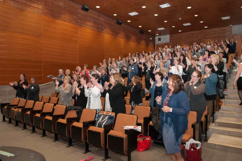 a large group in mcdougall hall lecture theatre