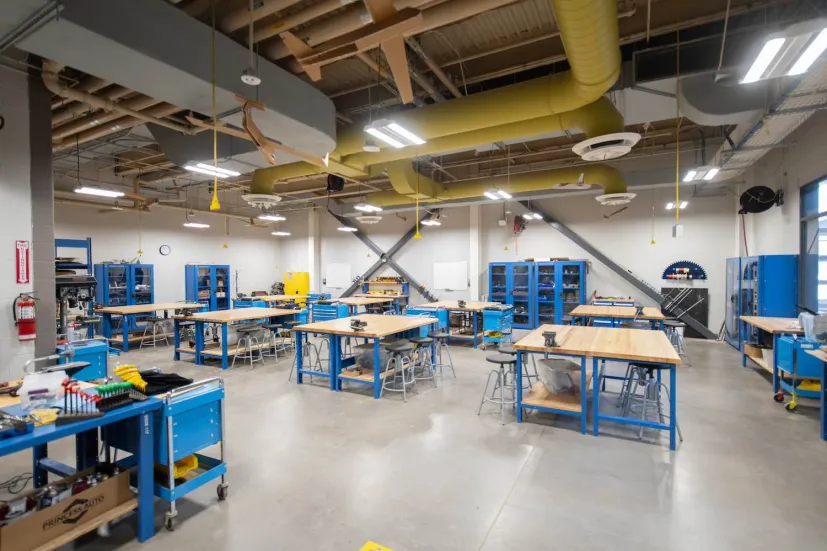 student workstations and blue desks in a shop area in the Faculty of Sustainable Design Engineering building