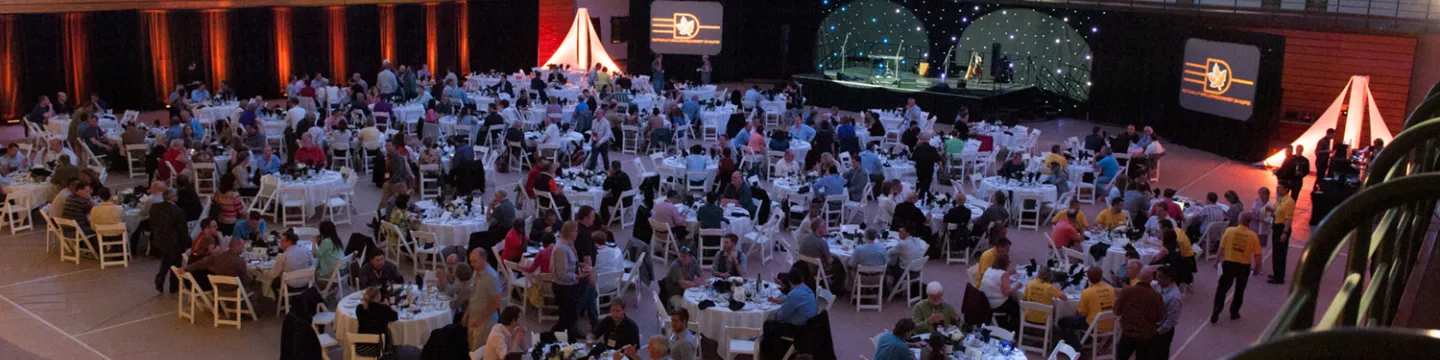 Gymnasium filled with tables for an event