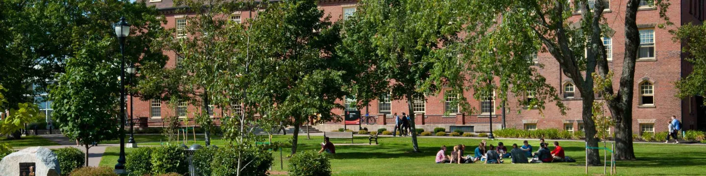 a group sitting outside UPEI main building 