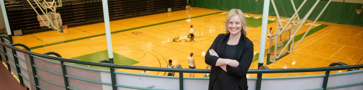 jane vessey standing on the walking track in the chi-wan young sports centre