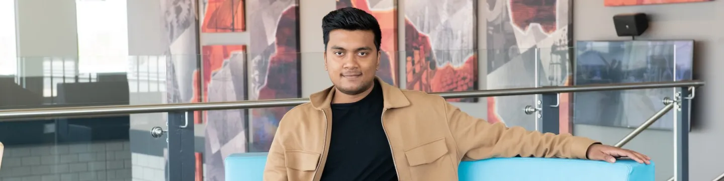 upei engineering student prabhakar bholah sitting in the faculty of sustainable design engineering building