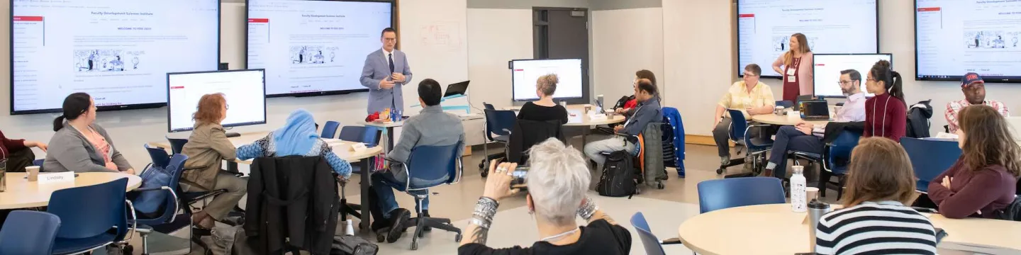 a group of faculty members listening to UPEI's Dr. Greg Naterer