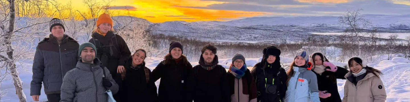 a group of students in Finland at sunset