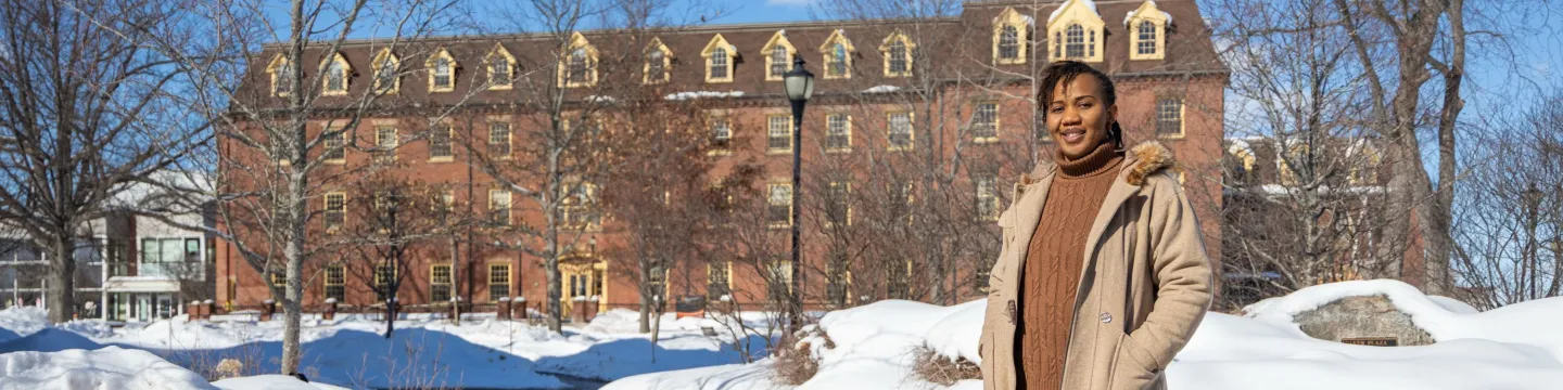 UPEI graduate Patience Adaobor standing in the quad in winter