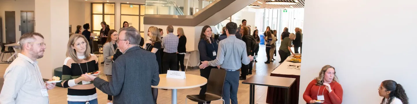 a large group of people at a research mixer