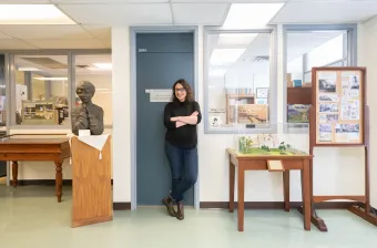 dr. kate scarth standing in front of the lucy maud montgomery institute office door