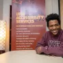 UPEI student Antwaun Rolle seated at boardroom table 