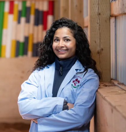 UPEI veterinary medicine student Anam in an indoor paddock