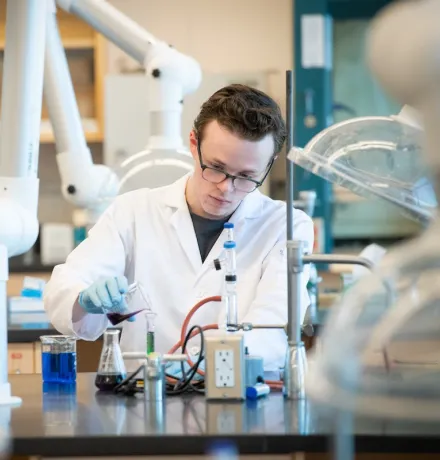 a UPEI chemistry student in a lab