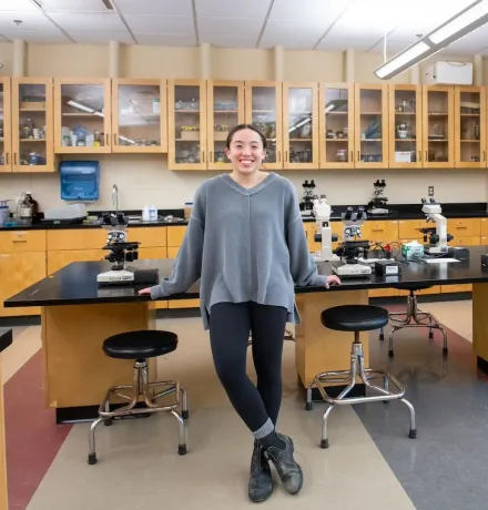 a UPEI biology student in a laboratory