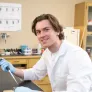 upei graduate student olivier philips working at a table