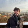 UPEI student Peter with a scenic afternoon skyline behind